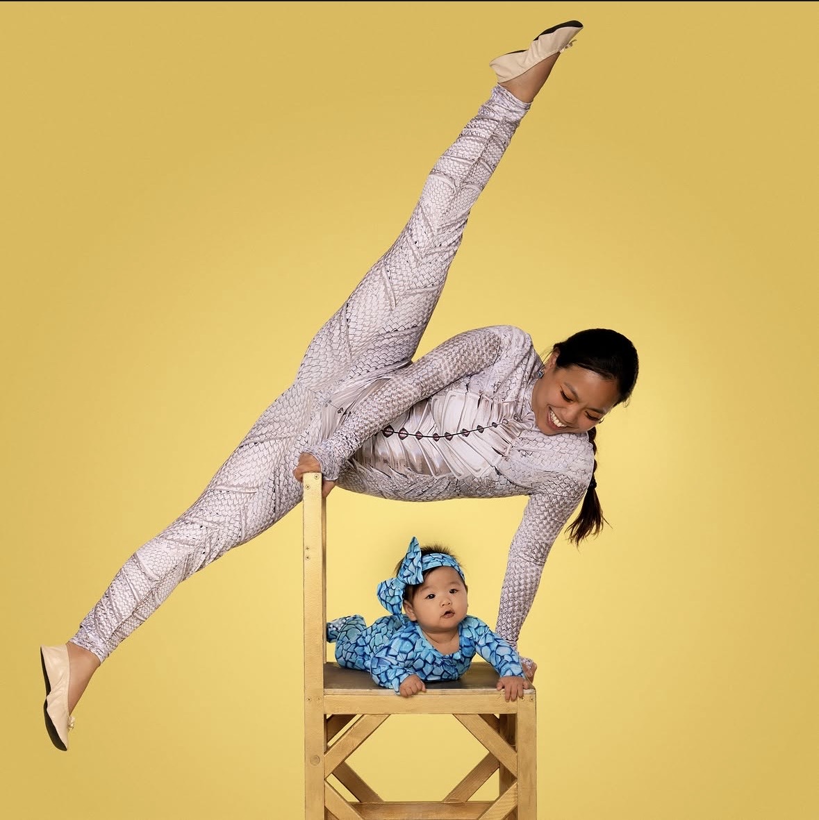A mother and baby together in a movement pose